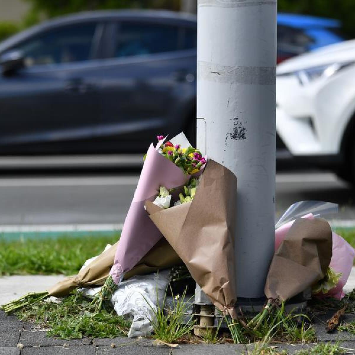 Flowers at the scene of a fatal crash in Alexandra Hills in Brisbane