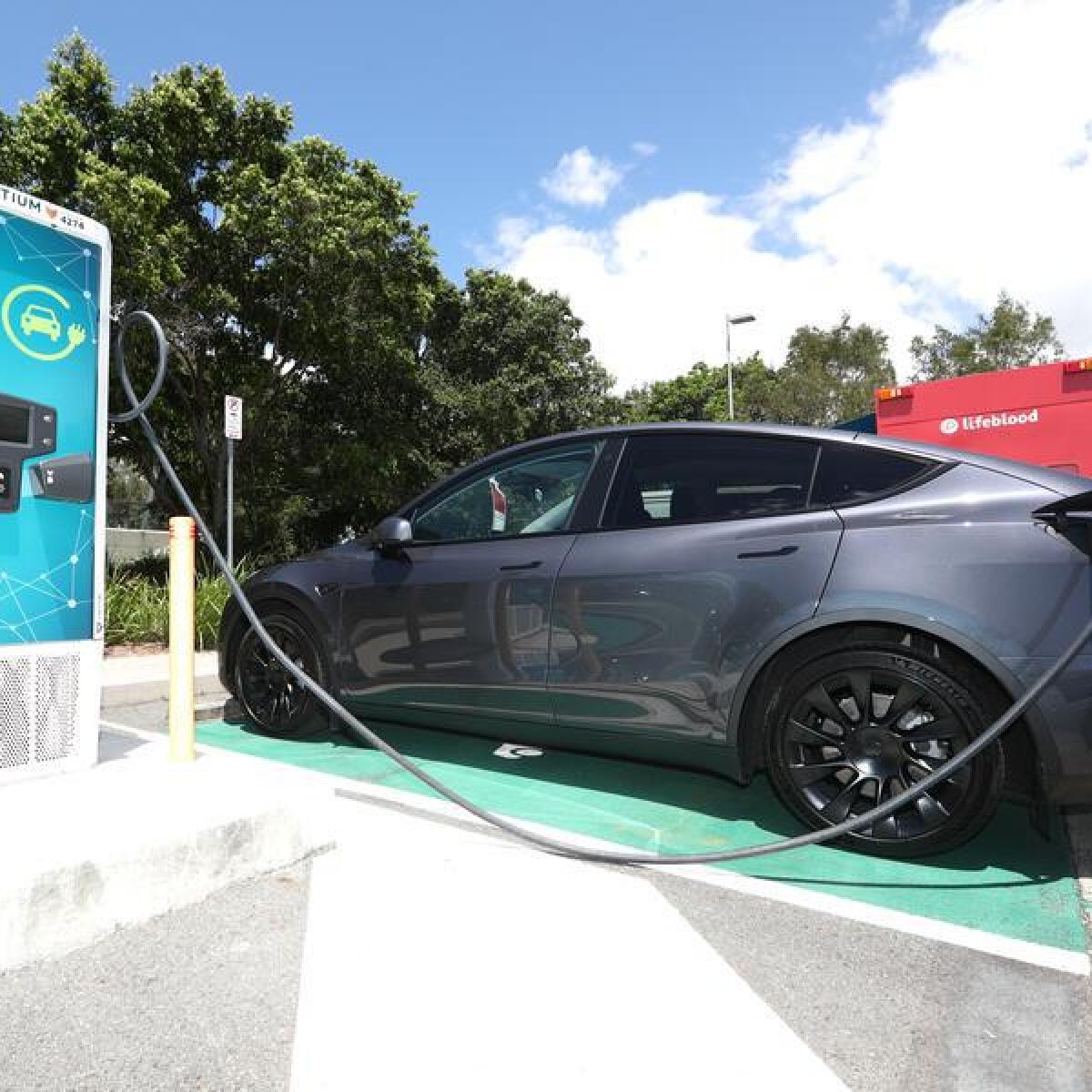 An EV at a charging station.
