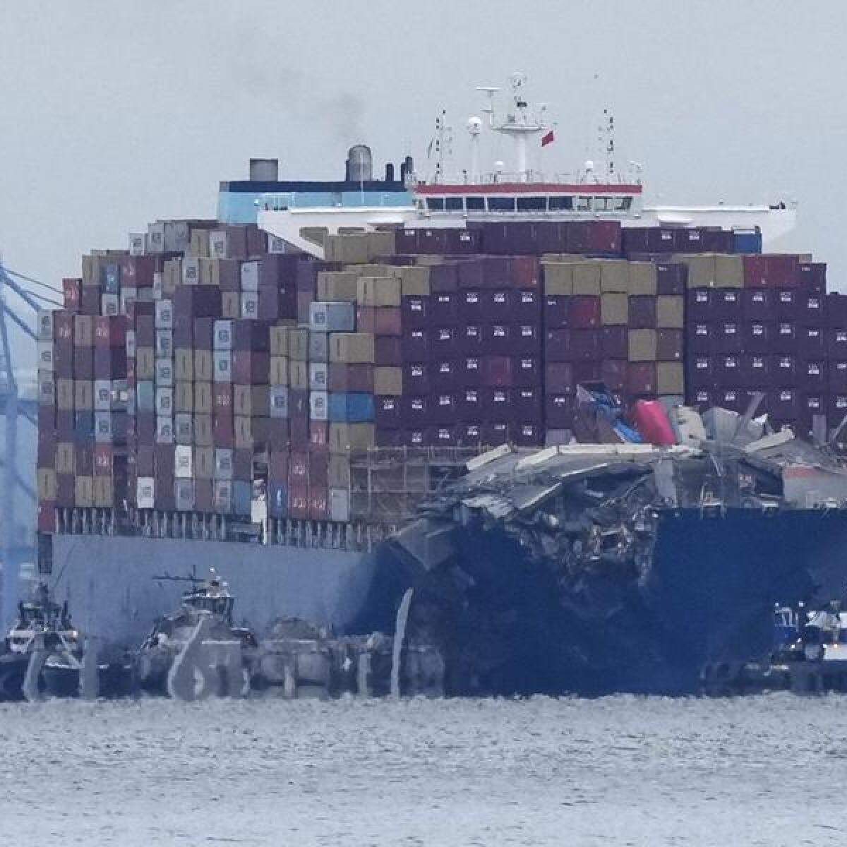 Crews work to move the cargo ship Dali in Baltimore, Monday