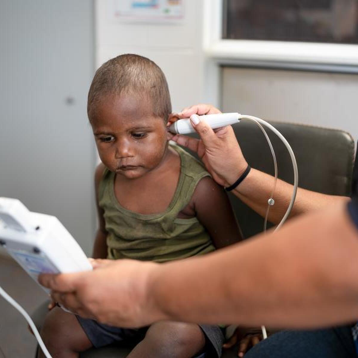 A child gets a hearing test.