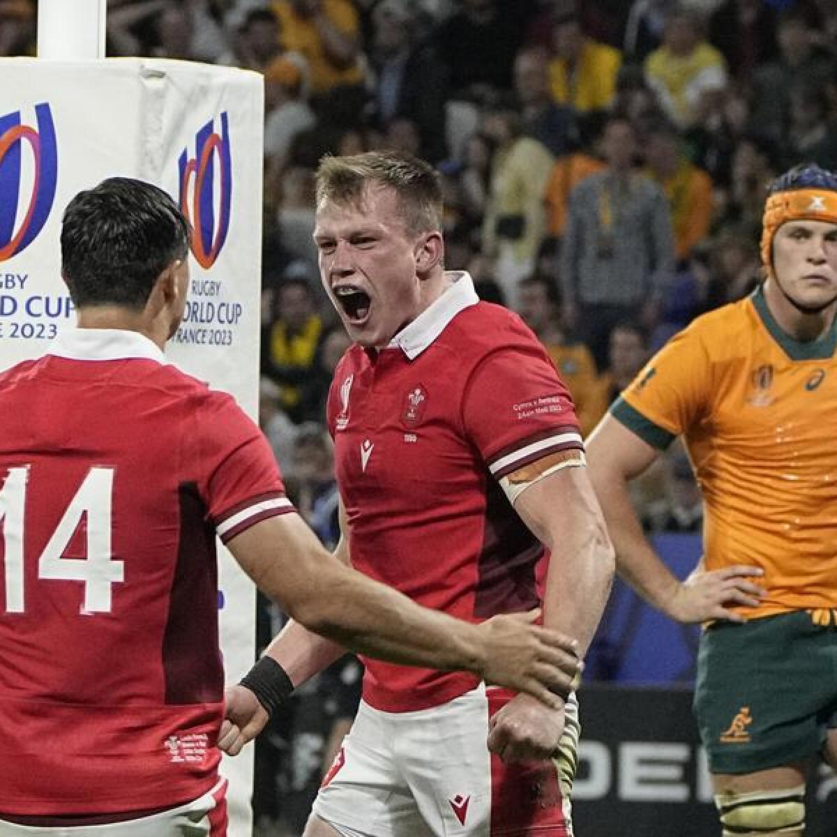 Wales players celebrate a World Cup try against the Wallabies. 