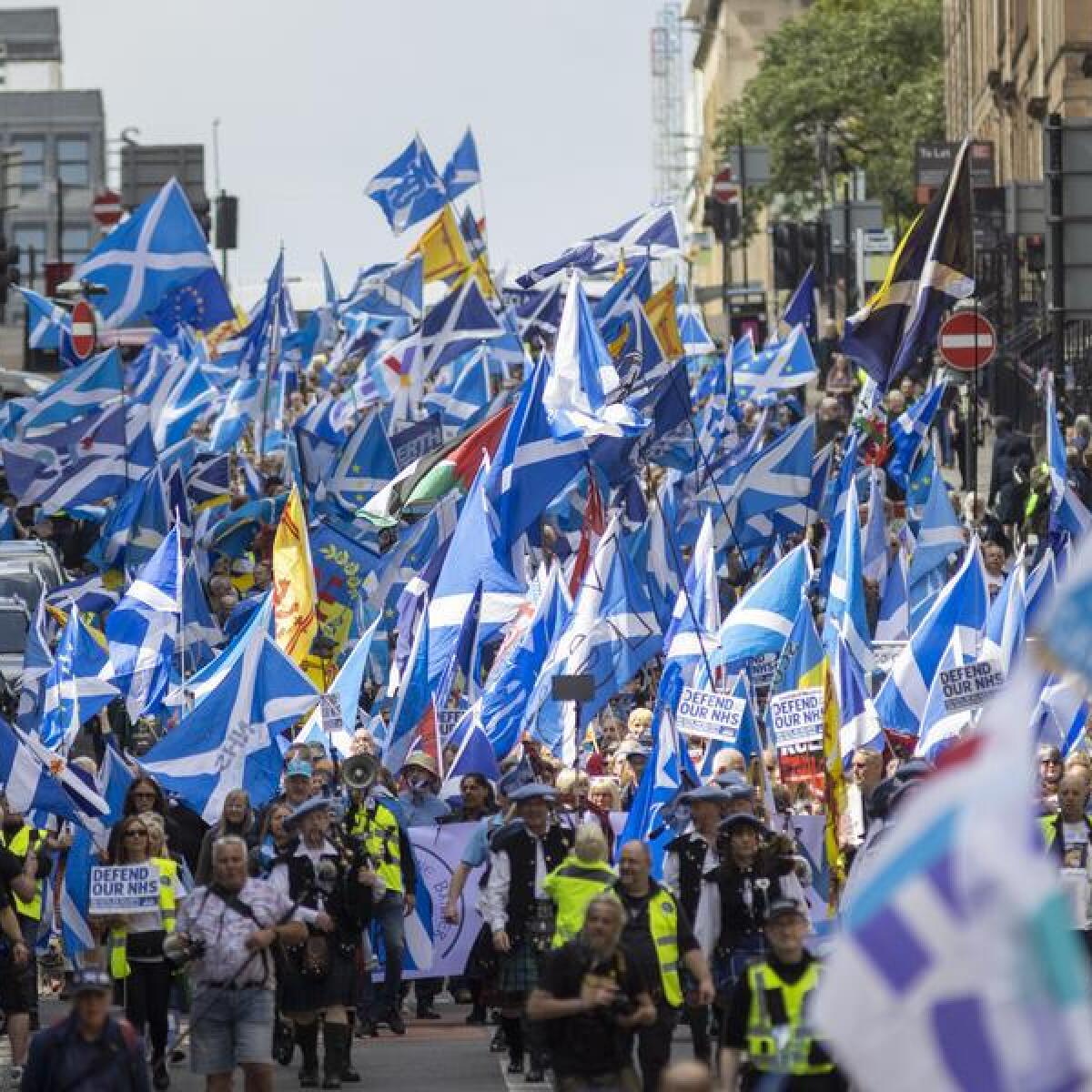 Scottish independence supporters march in Glasgow