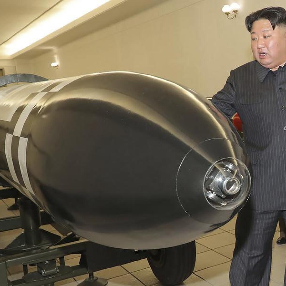 North Korean leader Kim Jong Un with missile.
