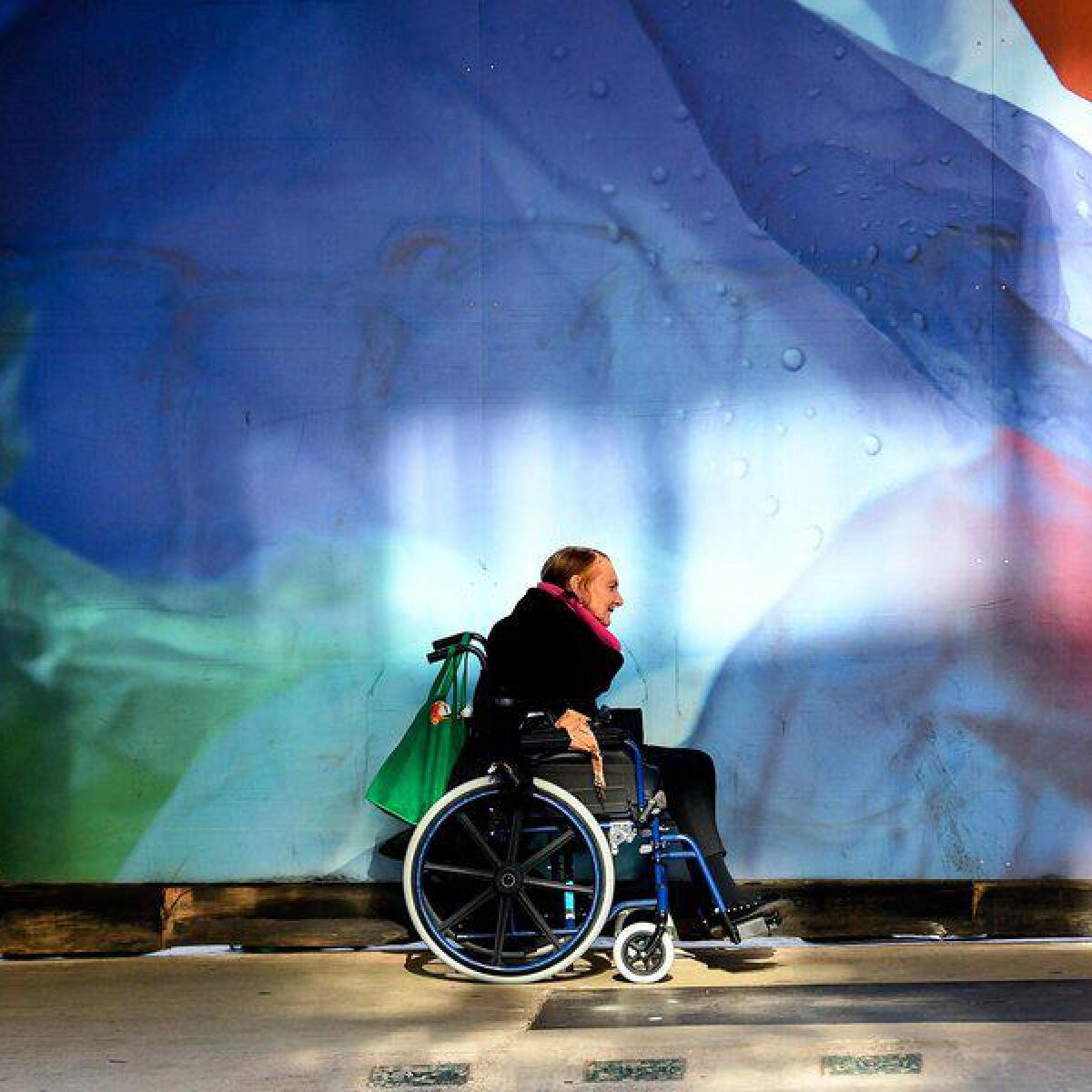 A wheelchair bound pedestrian