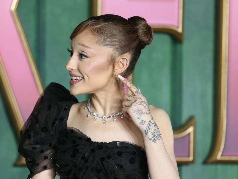 Red carpet pest grabs Ariana Grande at movie premiere