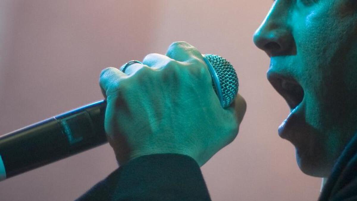 A person singing into a microphone (file image)