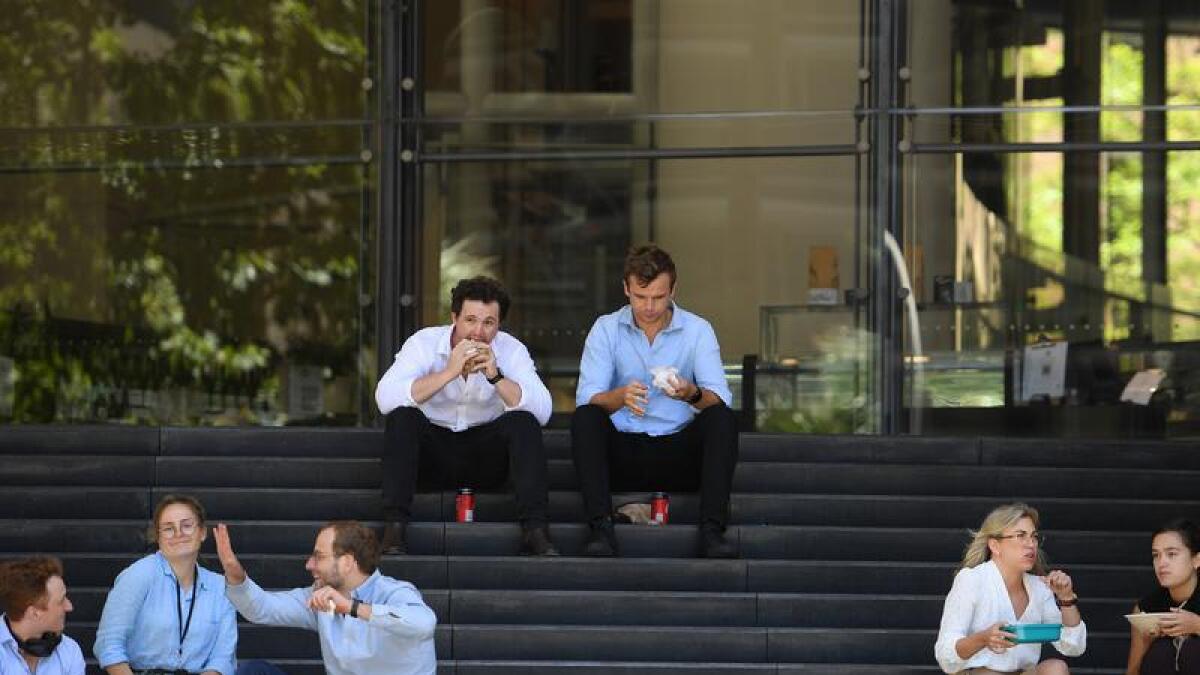 Office workers in Sydney have lunch.