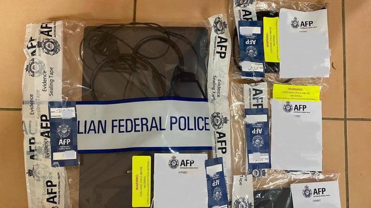 electronic devices seized by the AFP after a child abuse investigation