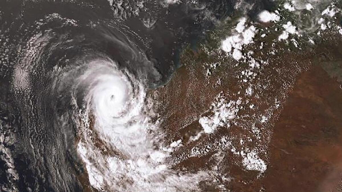 Satellite images of a cyclone over Australia.
