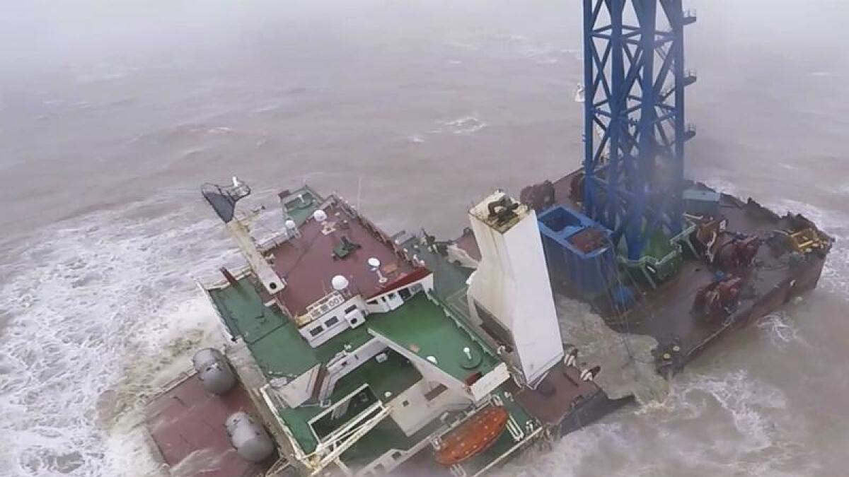 Two dozen crew are missing after a ship snapped in half off Hong Kong.