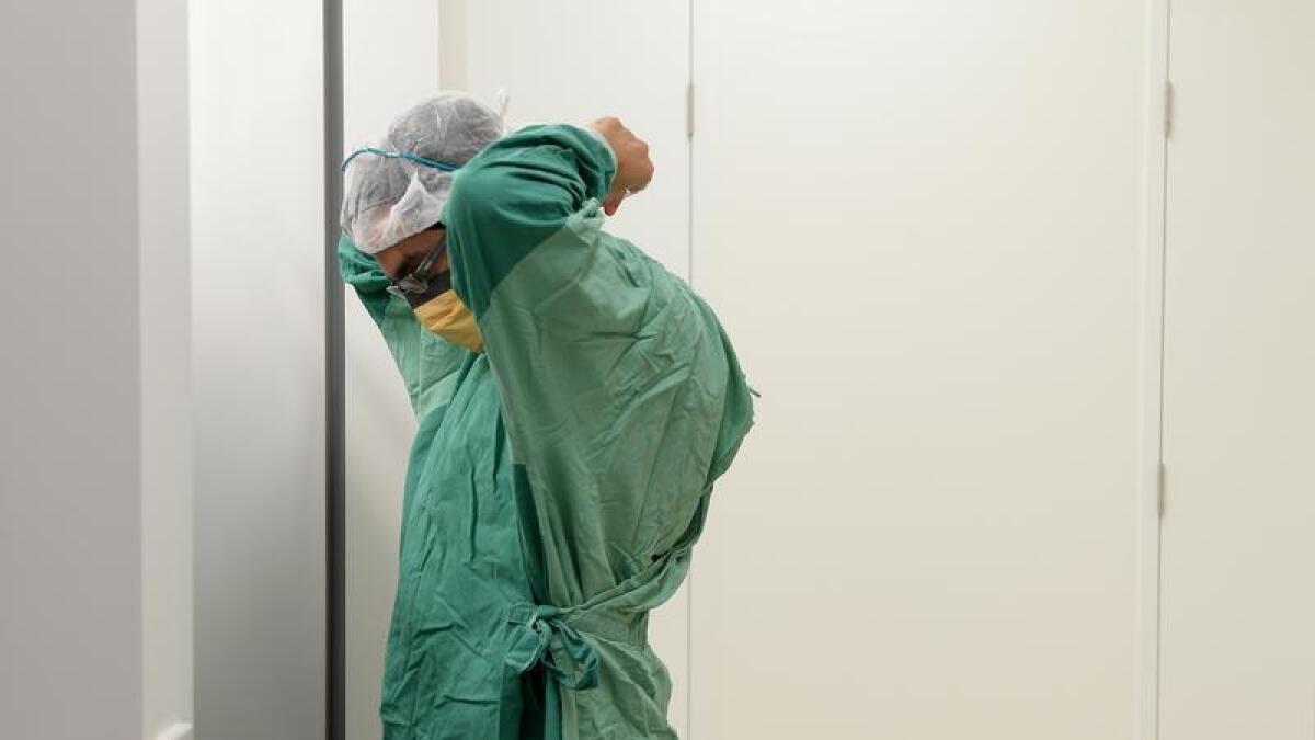 A surgeon prepares for theatre