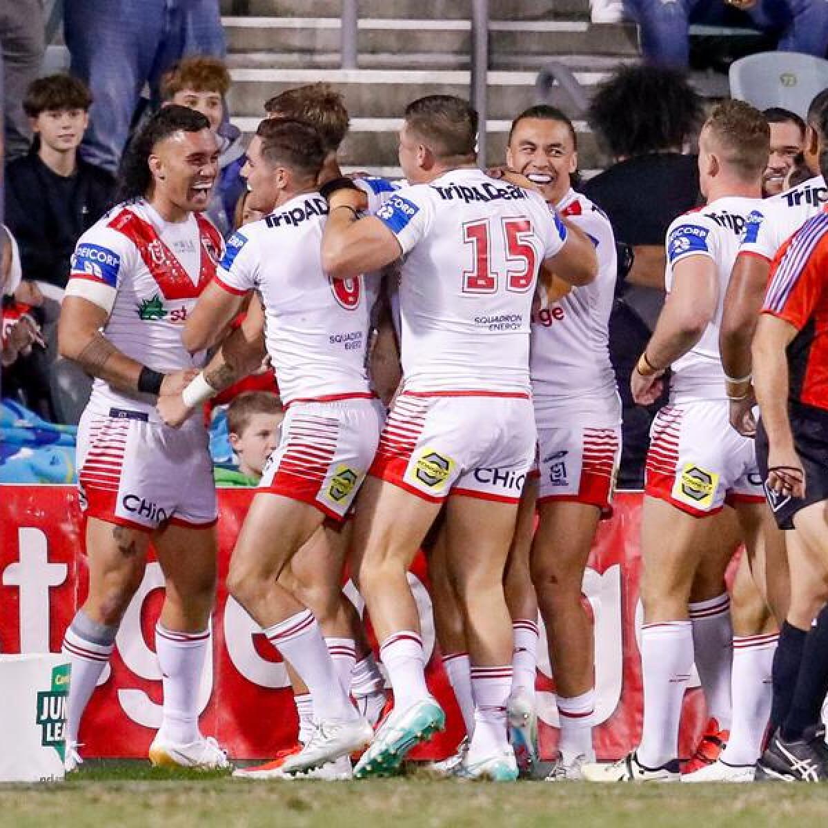 Dragons players celebrate after a try.