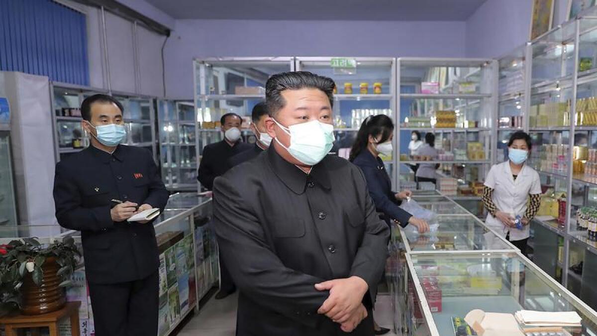 North Korean leader Kim Jong Un visits a pharmacy in Pyongyang