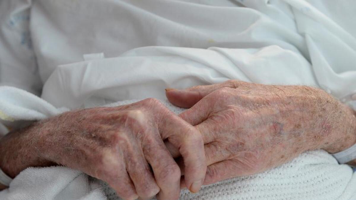 An elderly patient's hands