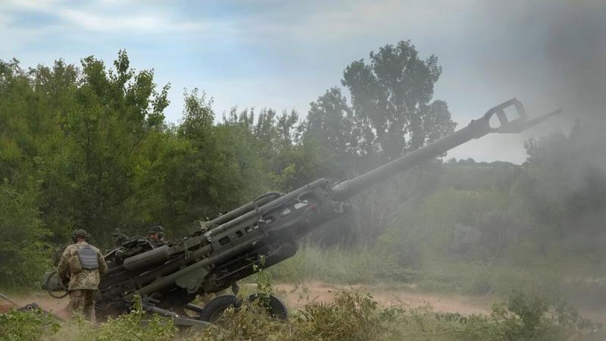 Ukrainian soldiers fire at Russian positions in the Donetsk region.