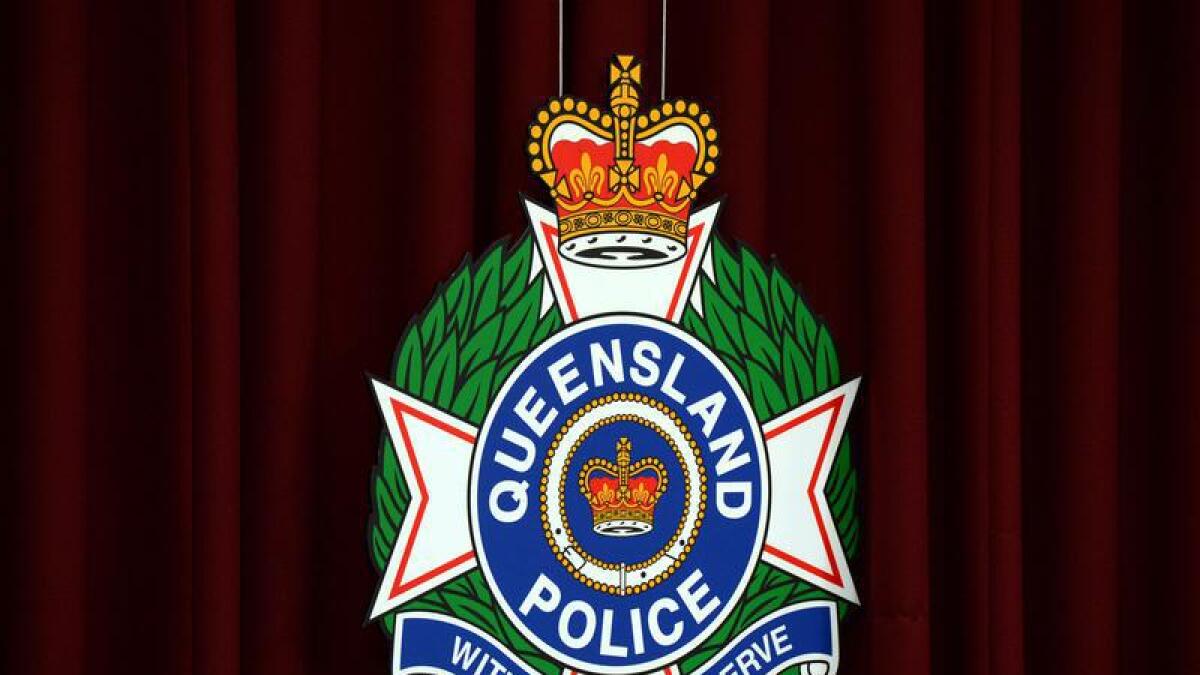 Queensland Police logo.