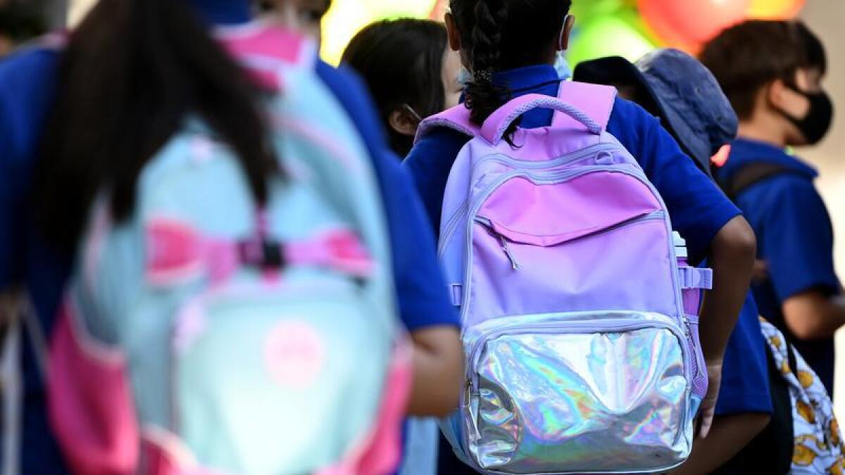 Primary school students return to school in Sydney