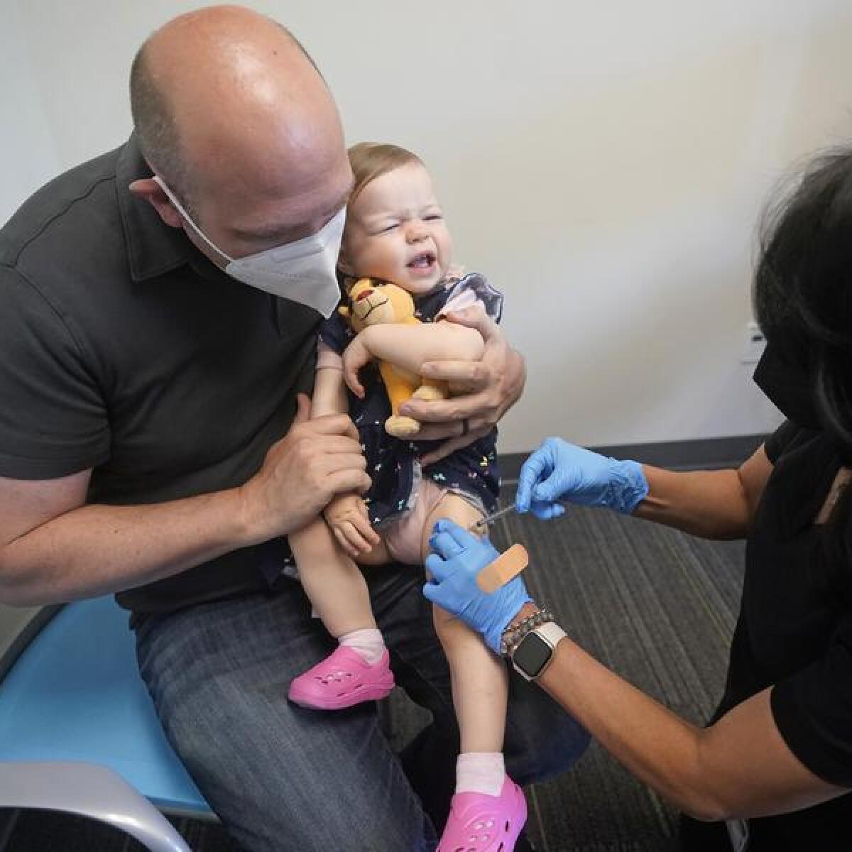 A child gets a COVID-19 vaccine in the United States.