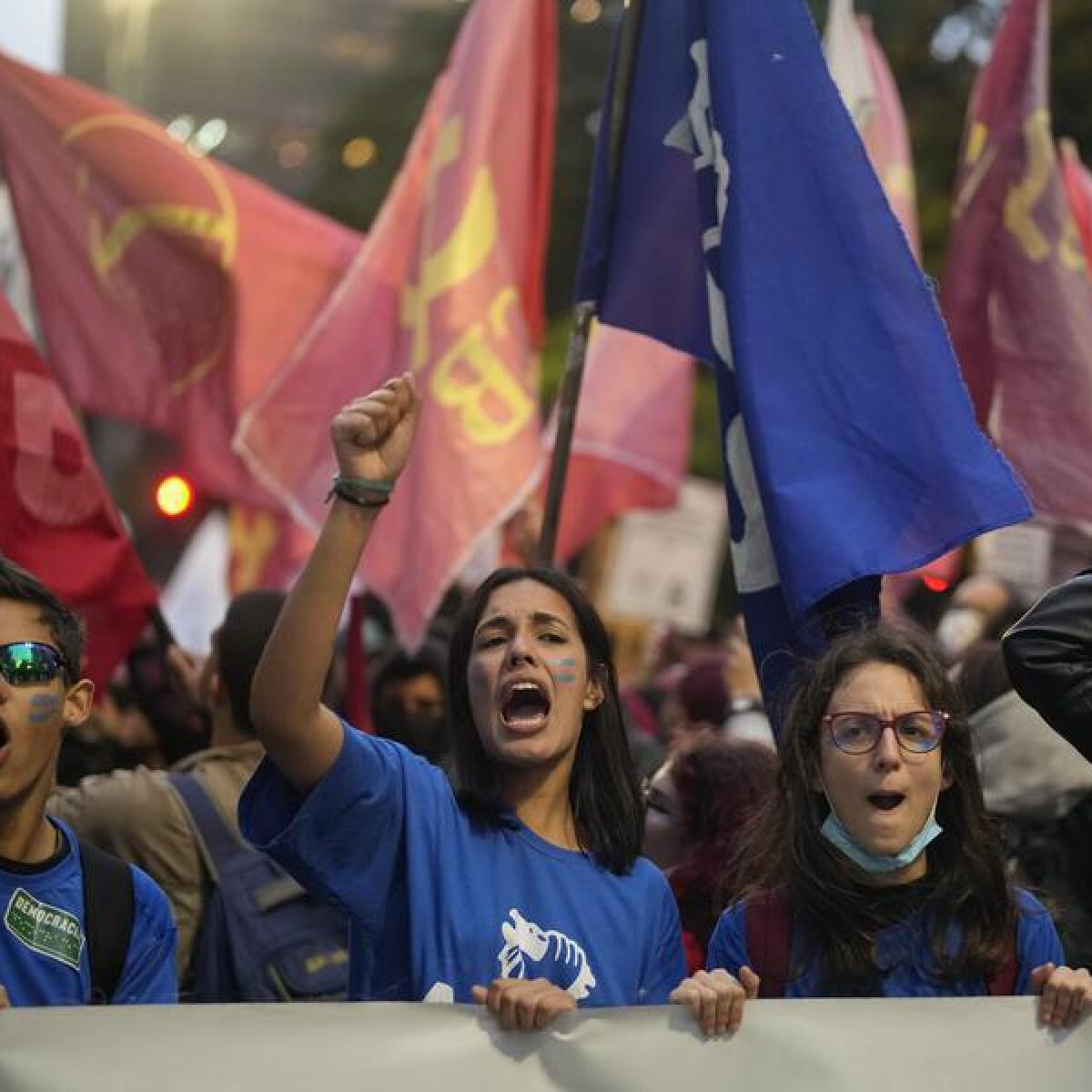 Students shout slogans against Brazil's president.