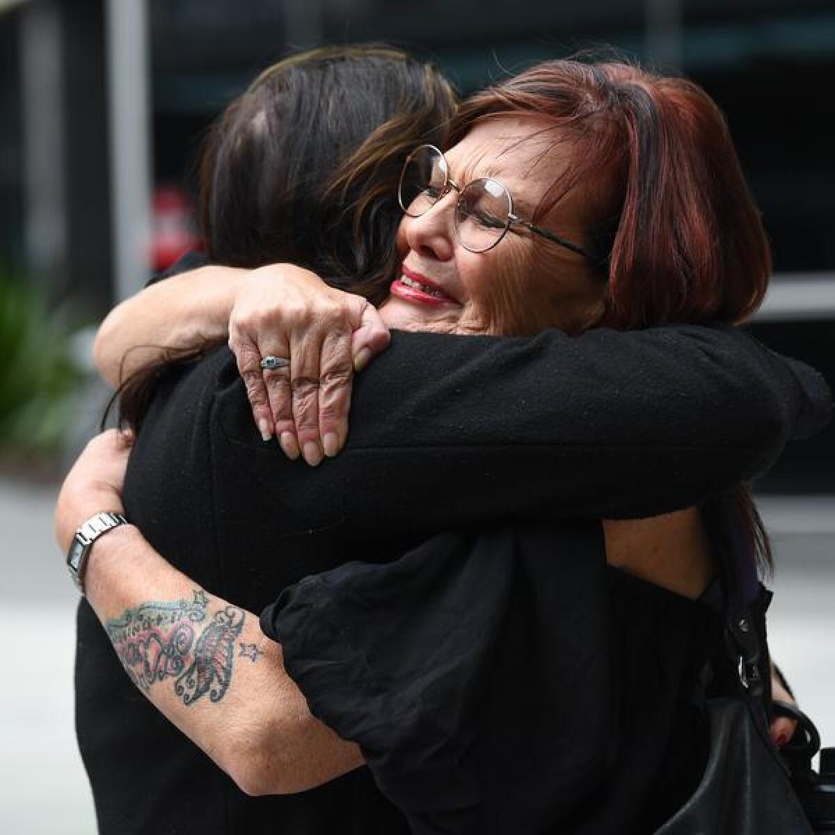 Alison Russell (right) is seen outside Brisbane Magistrates Court