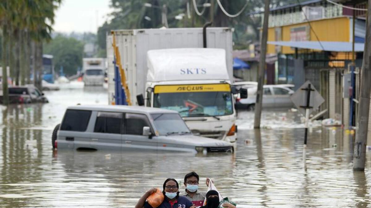 At least eight people have died in floods that have ravaged Malaysia.