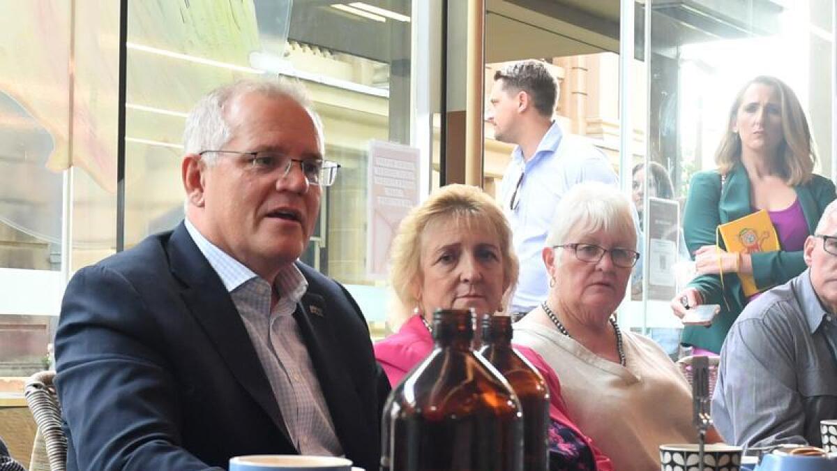 Prime Minister Scott Morrison at a coffee shop in Rockhampton.