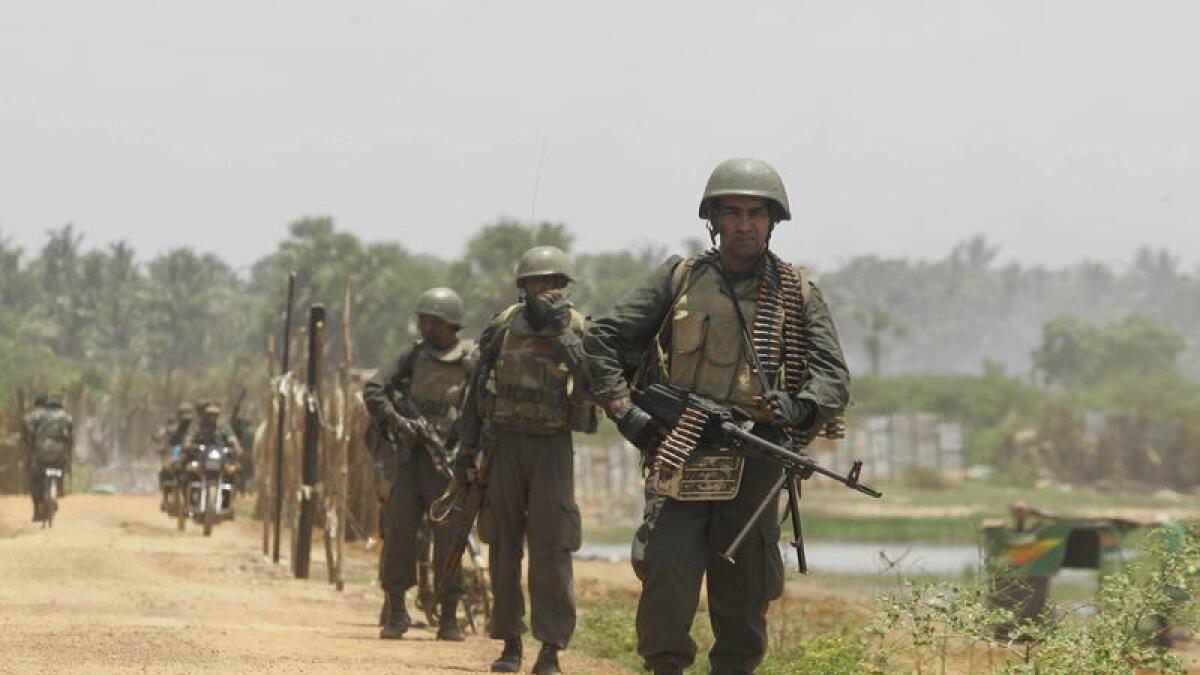 Sri Lankan soldiers patrol during the country's civil war.