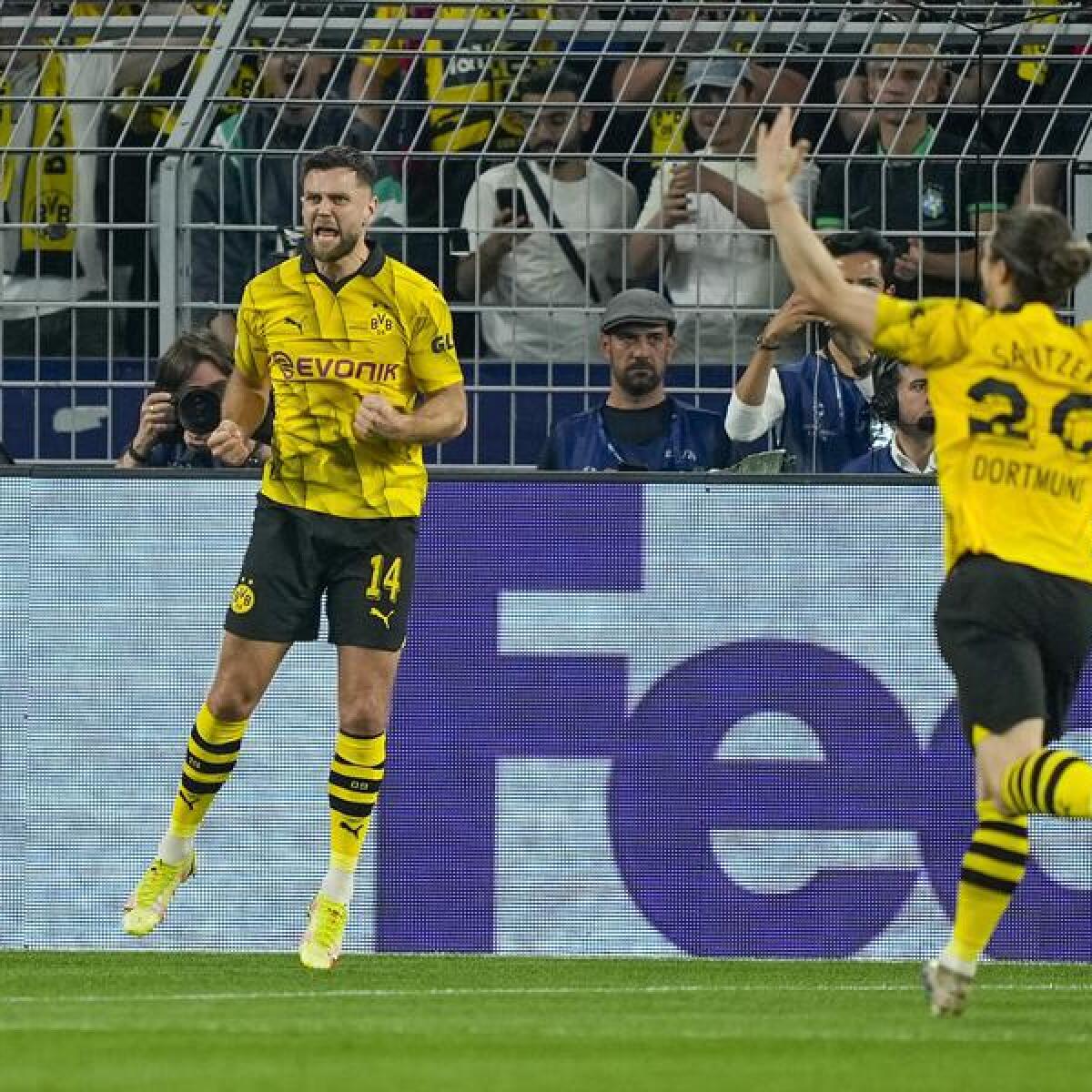 Dortmund's Niclas Fullkrug (centre) scores.