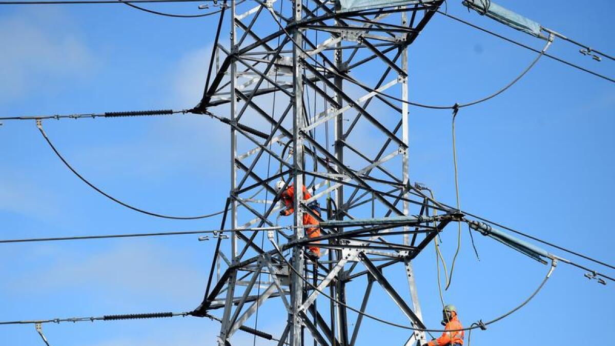 Workers on an electricity pylon in suburban Sydney (file image)