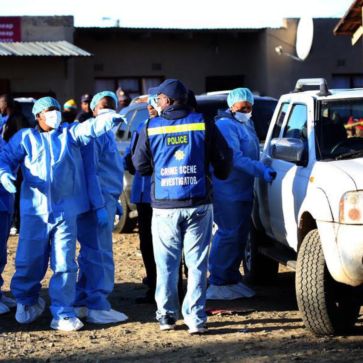 Police and forensics experts at scene of tavern in South Africa