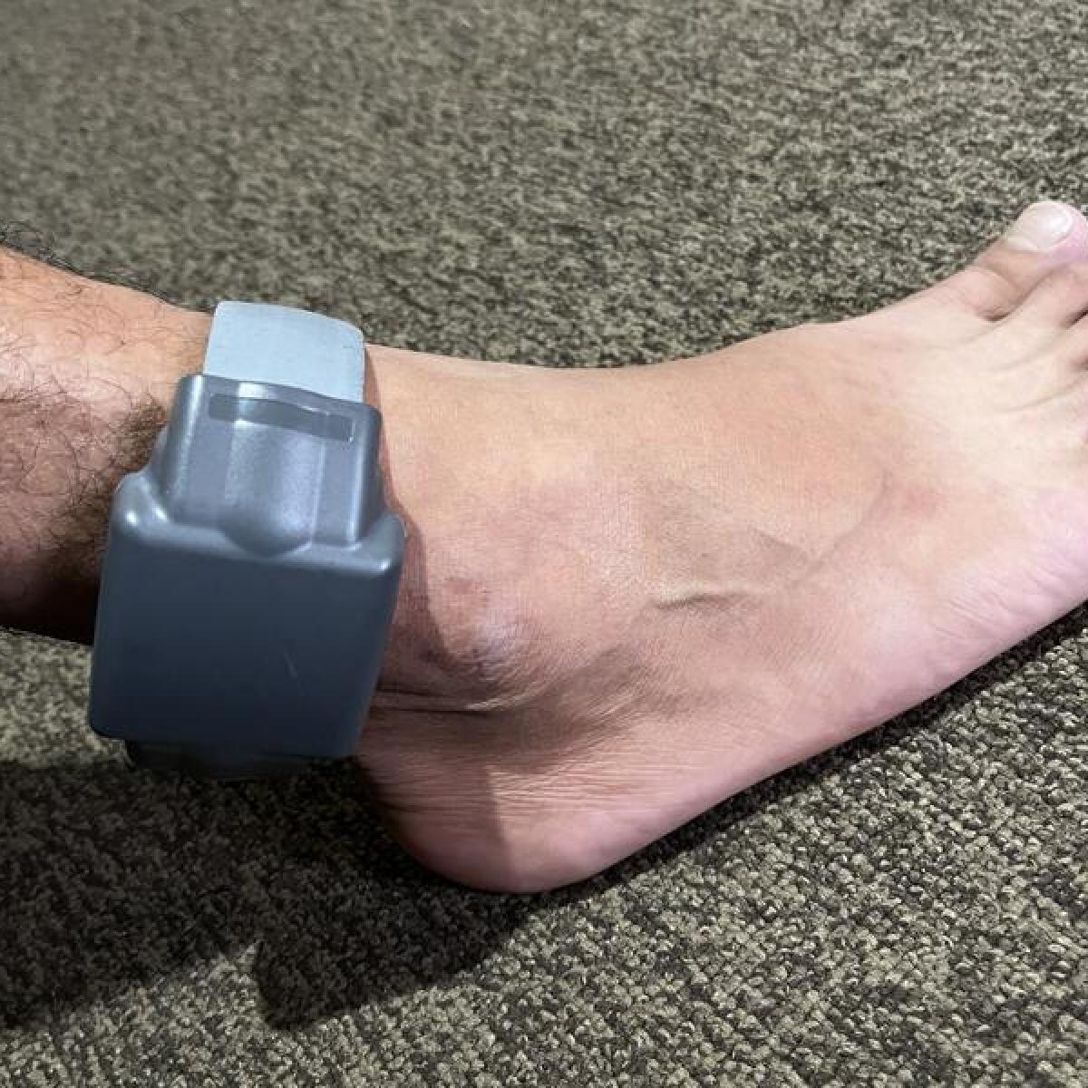 An electronic monitoring ankle bracelet