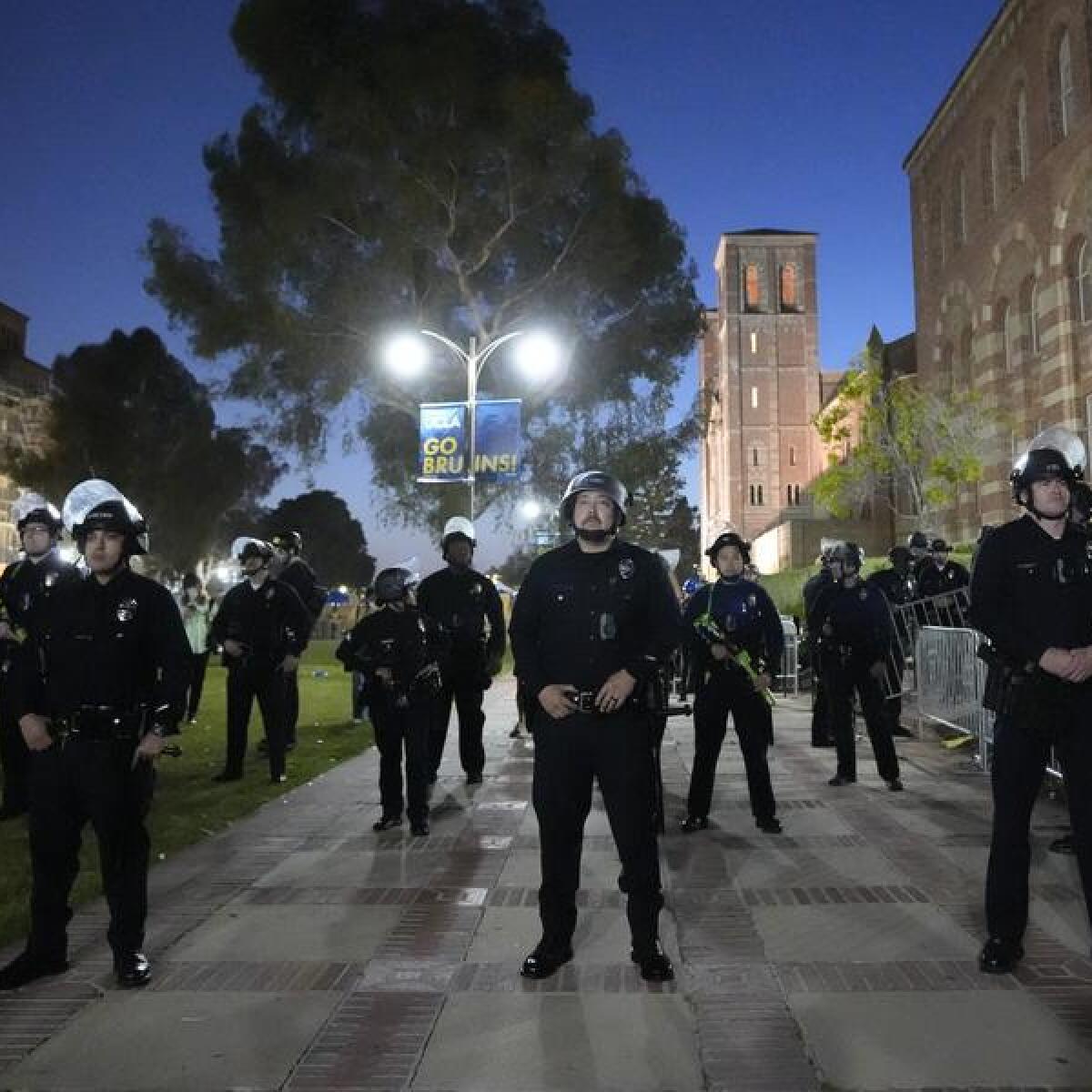 Police stage on the UCLA campus near a protest encampment