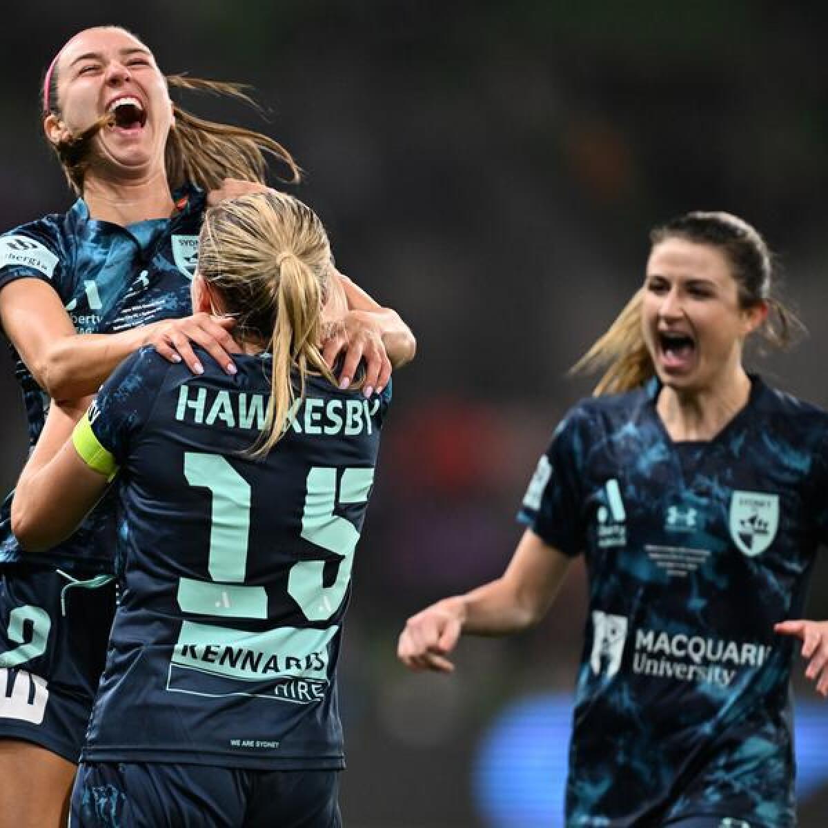 Shea Connors (left) celebrates her grand final goal. 