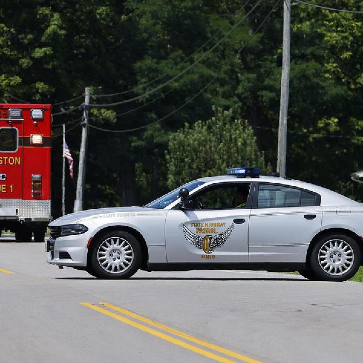 Ohio police seal off a road during a standoff with an armed man.