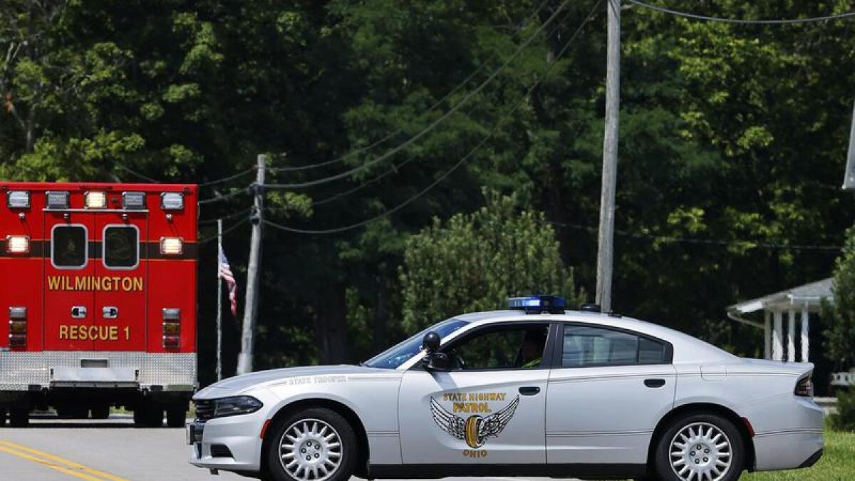 Ohio police seal off a road during a standoff with an armed man.