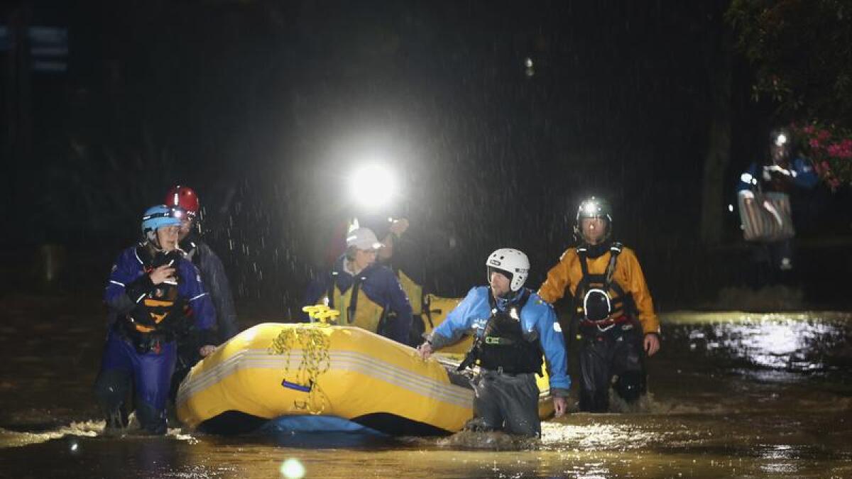 Emergency workers rescue stranded residents in Nelson, New Zealand.