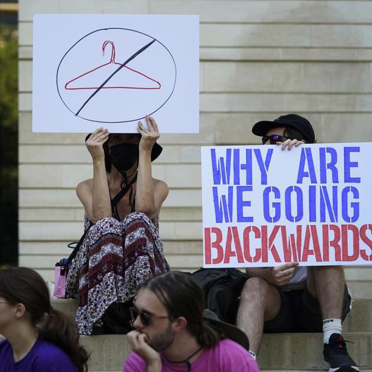 Demonstrators hold placards (file image)