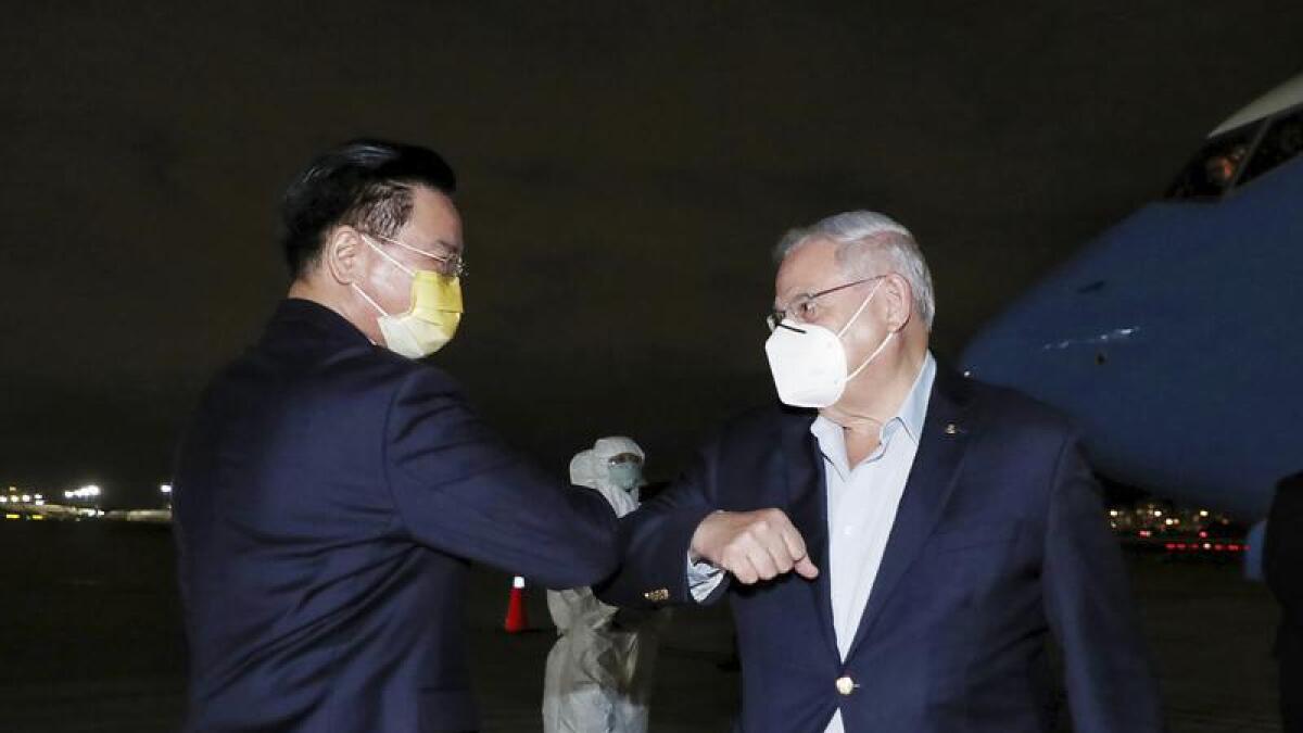 Taiwan Foreign Minister Joseph Wu greets US Senator Bob Menendez.
