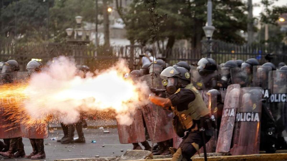 Police clash with demonstrators in Lima, Peru