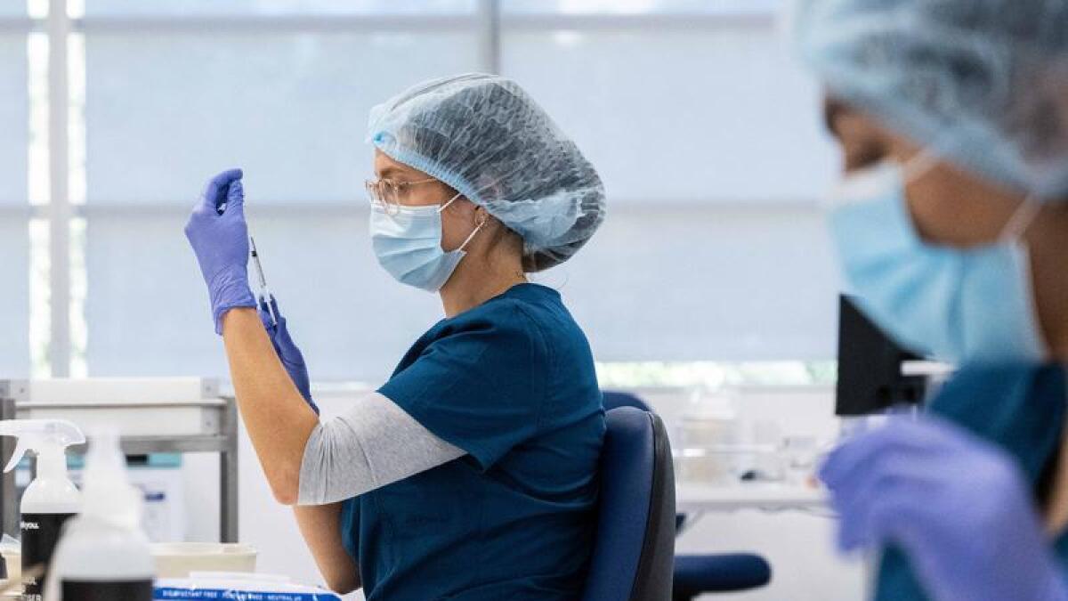 Staff preparing COVID-19 vaccines at Homebush (file)