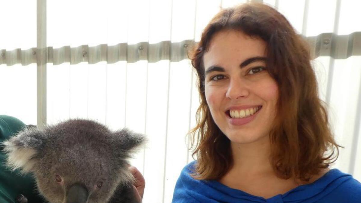 University of Queensland researcher Michaela Blyton with a koala.
