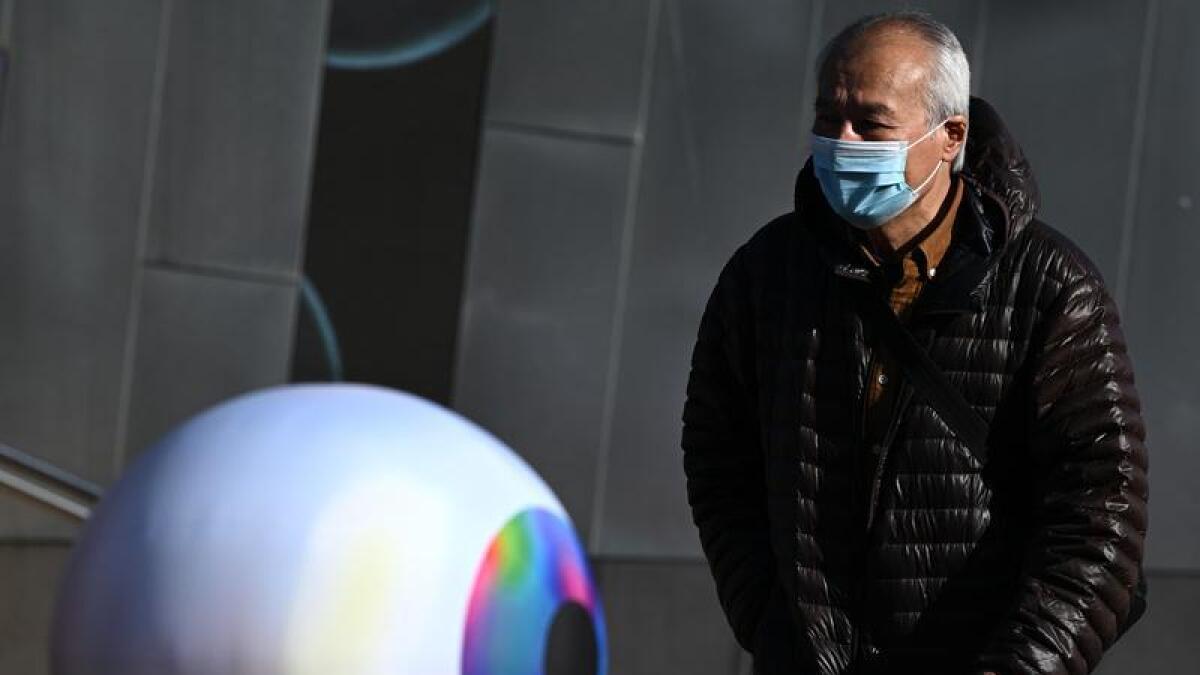 Image of Melbourne pedestrian wearing face mask