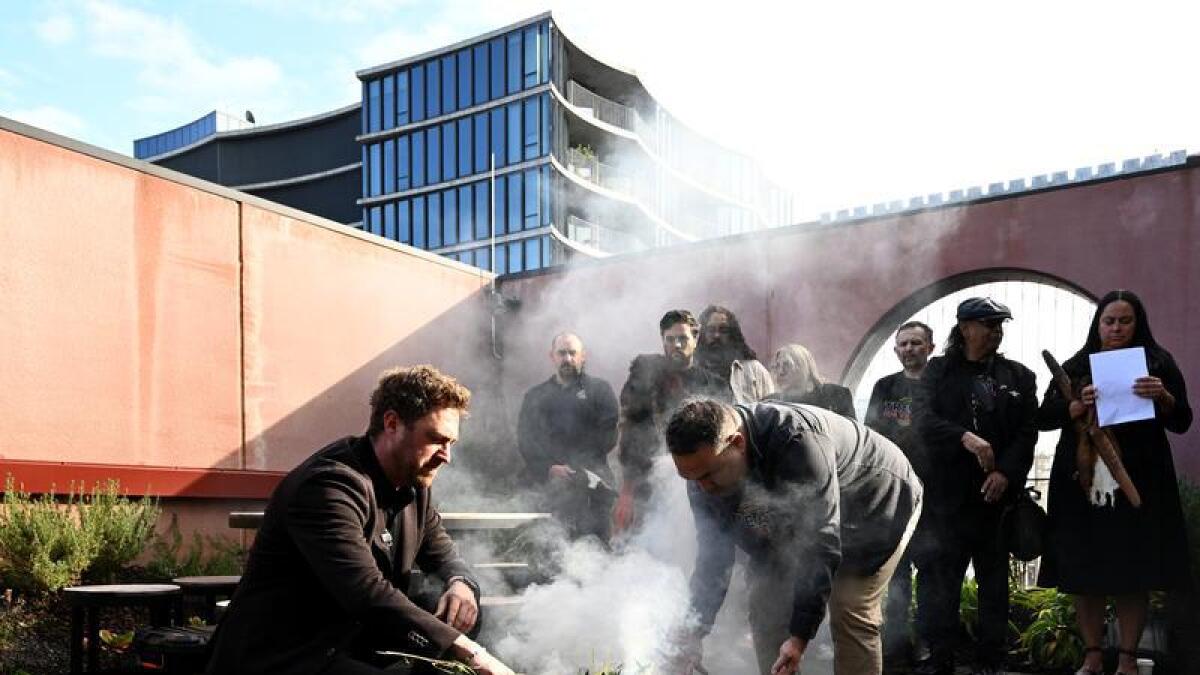 A smoking ceremony with Yoorrook Justice Commission members and guests