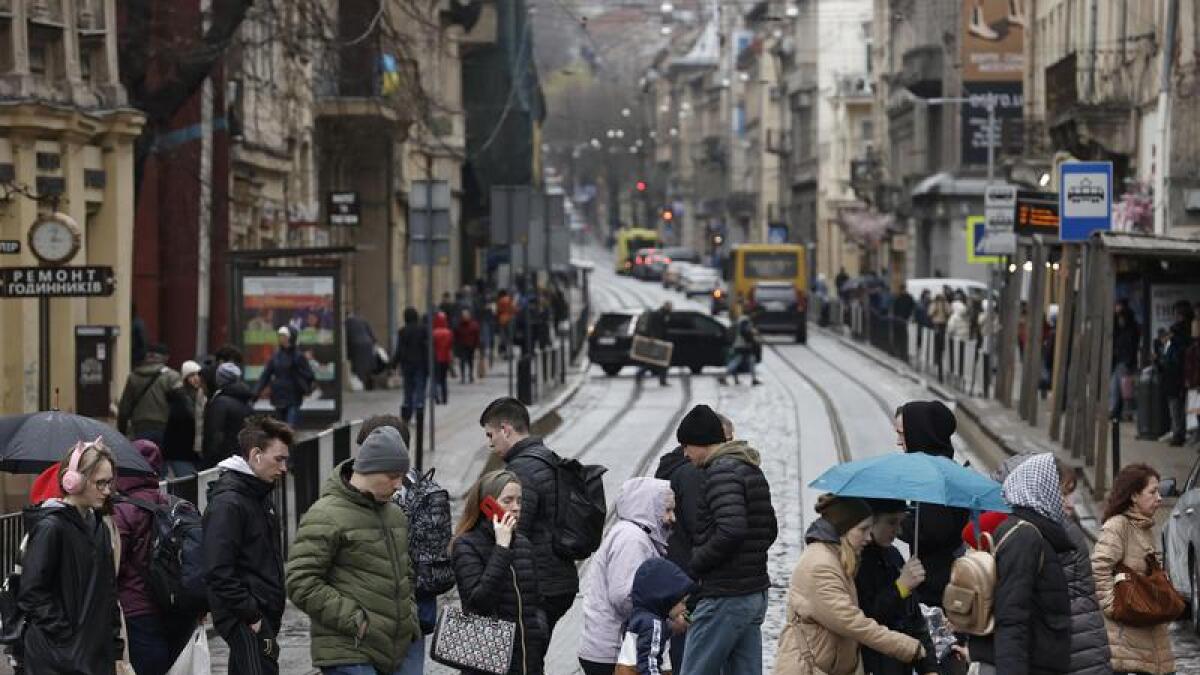 People walk on a street in Lviv, western Ukraine