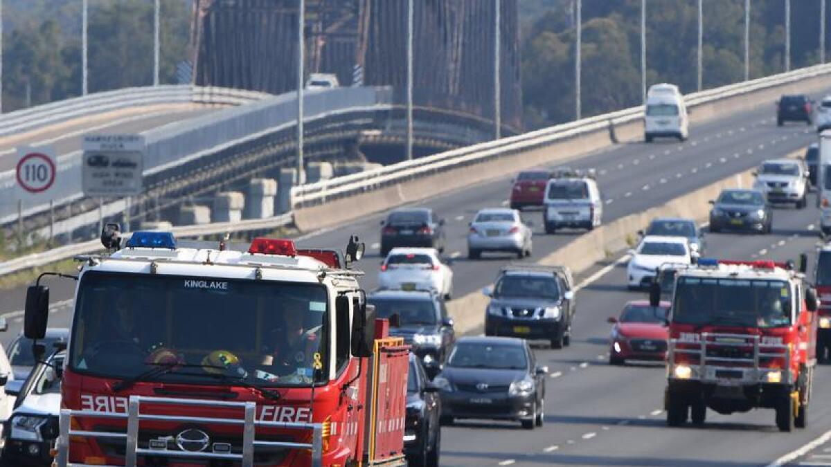 A convoy of Country Fire Authority (CFA) fire fighting trucks.