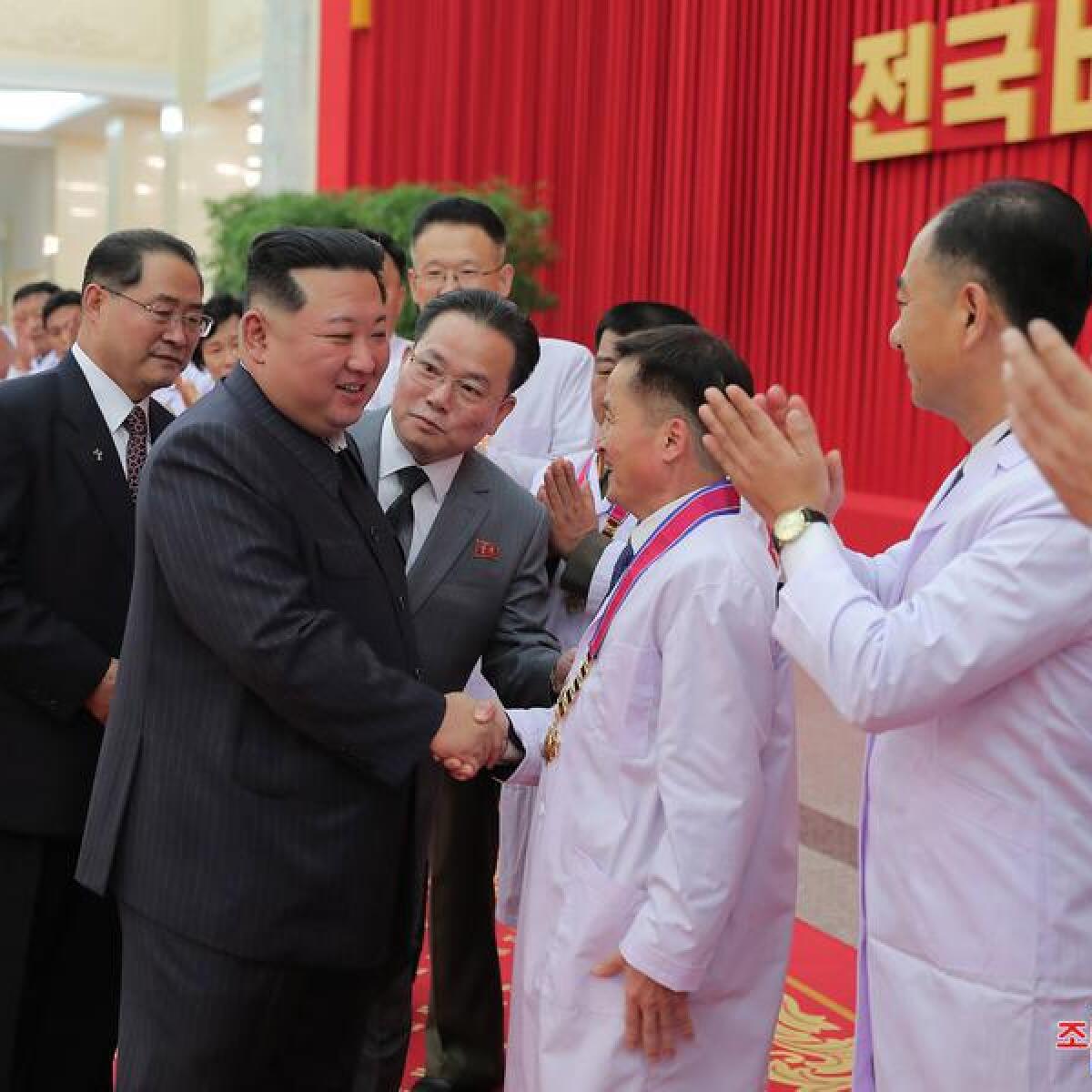 Kim Jong-un with officials