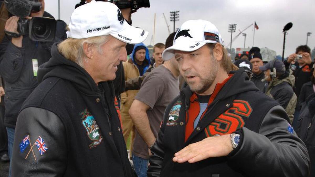 Greg Norman talks with Russell Crowe.