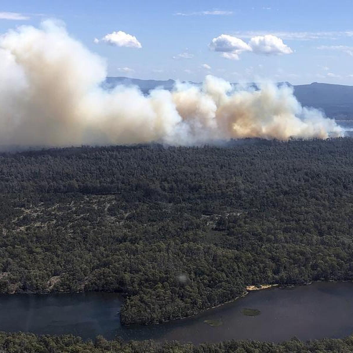 A supplied image shows a bushfire in Tasmania's Central Highlands