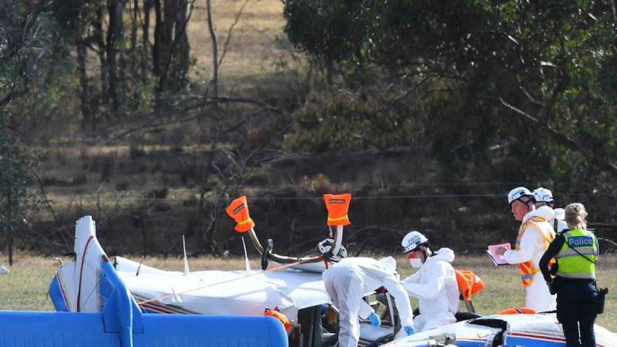 Emergency service crew at the wreckage of a light aircraft in Victoria