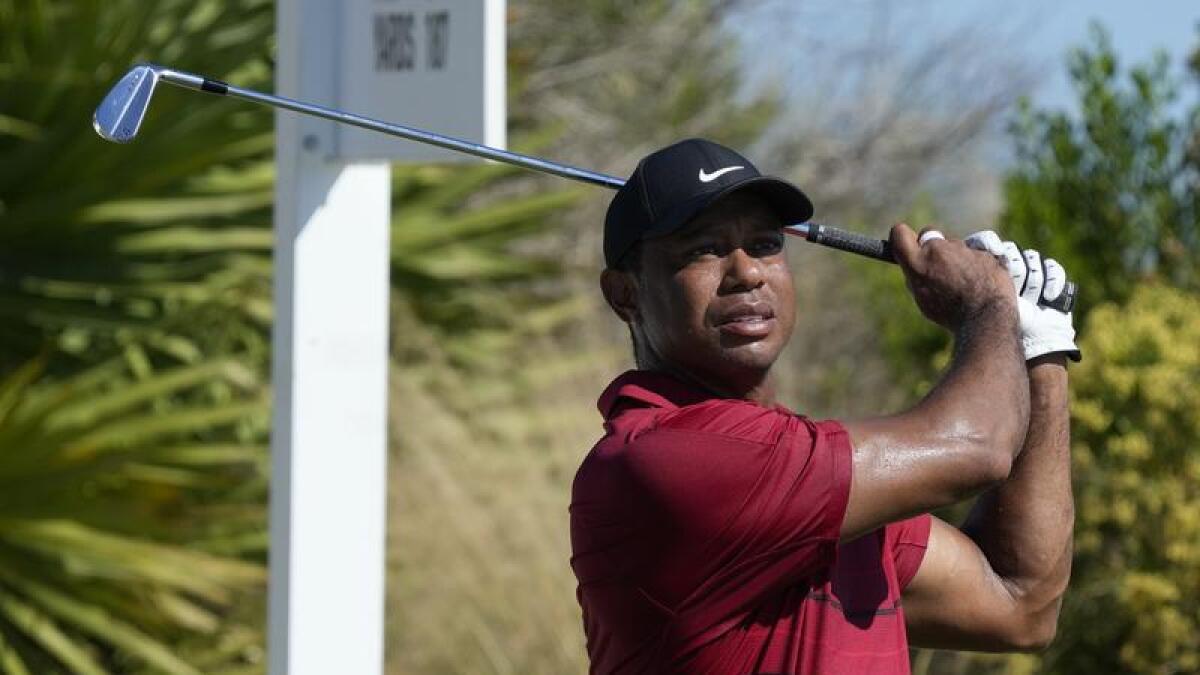Tiger Woods drives at the World Hero Challenge